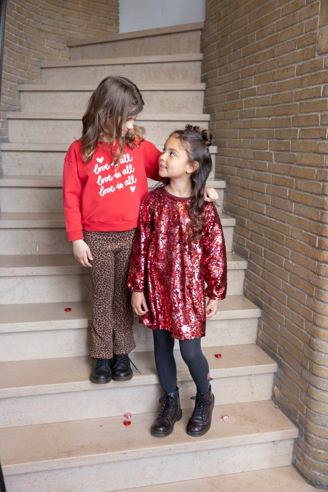 -Jubel Maillot - Queen Of Hearts Sfeerfoto: "Kind draagt de Jubel Maillot - Queen Of Hearts in Antraciet, met een speels strik ontwerp, perfect voor een winterwandeling of schooloutfit."